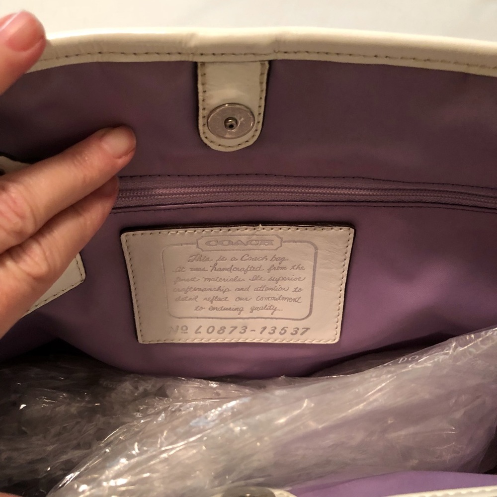 White and grey coach purse